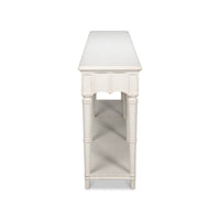 End view of antique white console table.