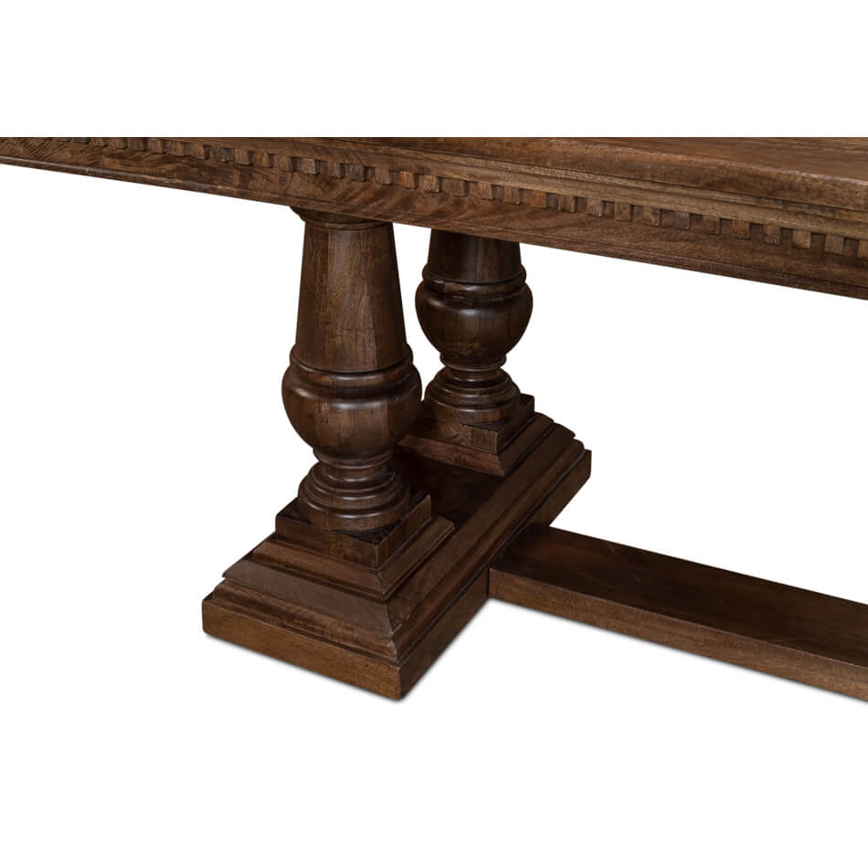 Close-up of dining table legs, carved pedestal base.