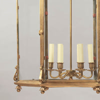 Close-up of lantern's candle holders and glass panels.