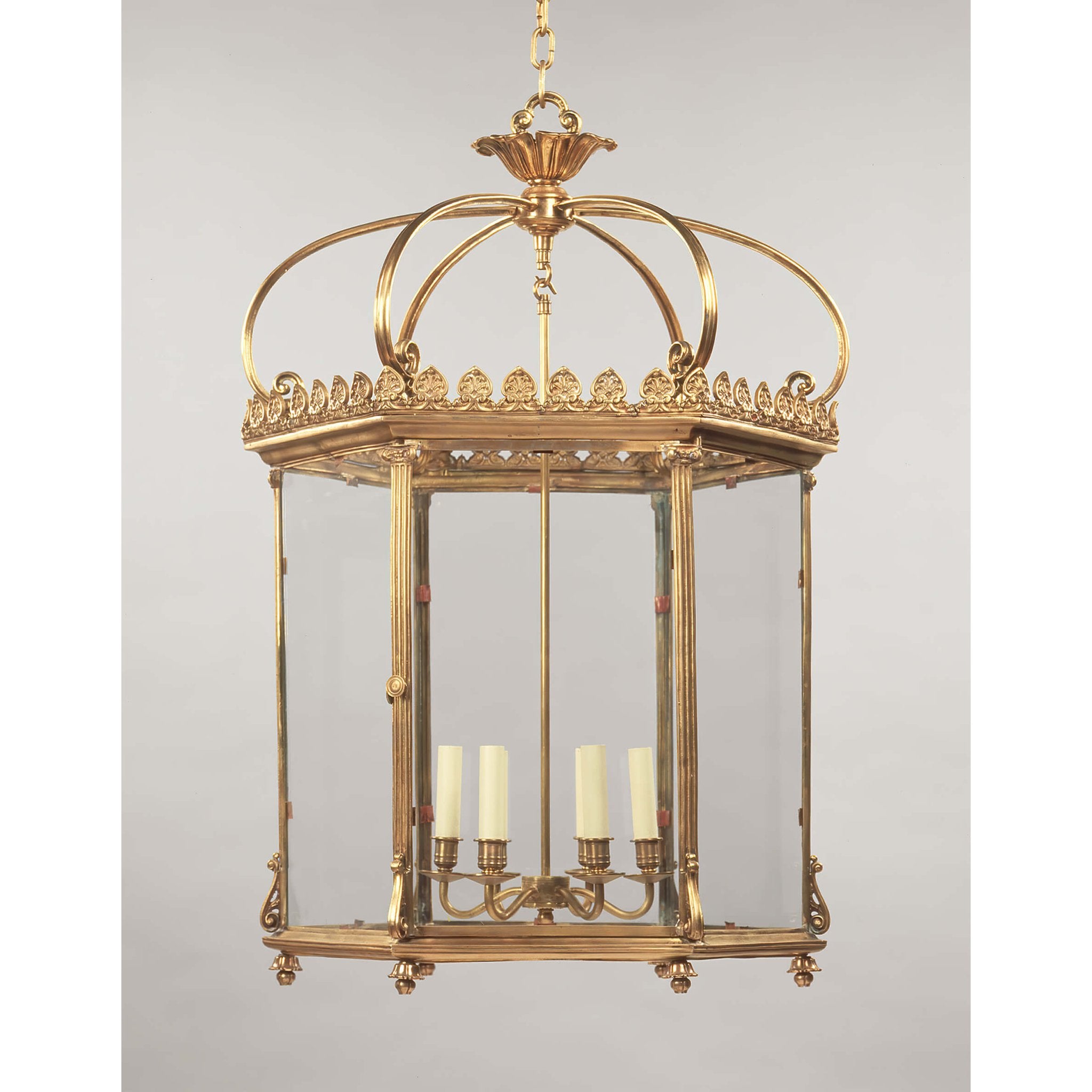 Elegant Georgian hexagonal lantern suspended in light background.