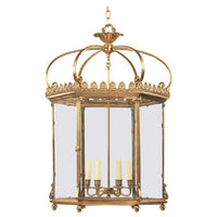 Gold hexagonal lantern with crown detail, frontal view.