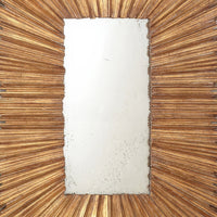 Center of gold sunburst mirror with ornate frame detail.
