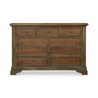 Front view of large mahogany dresser, nine drawers, white background.