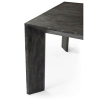 Dining table corner close-up with leg detail.