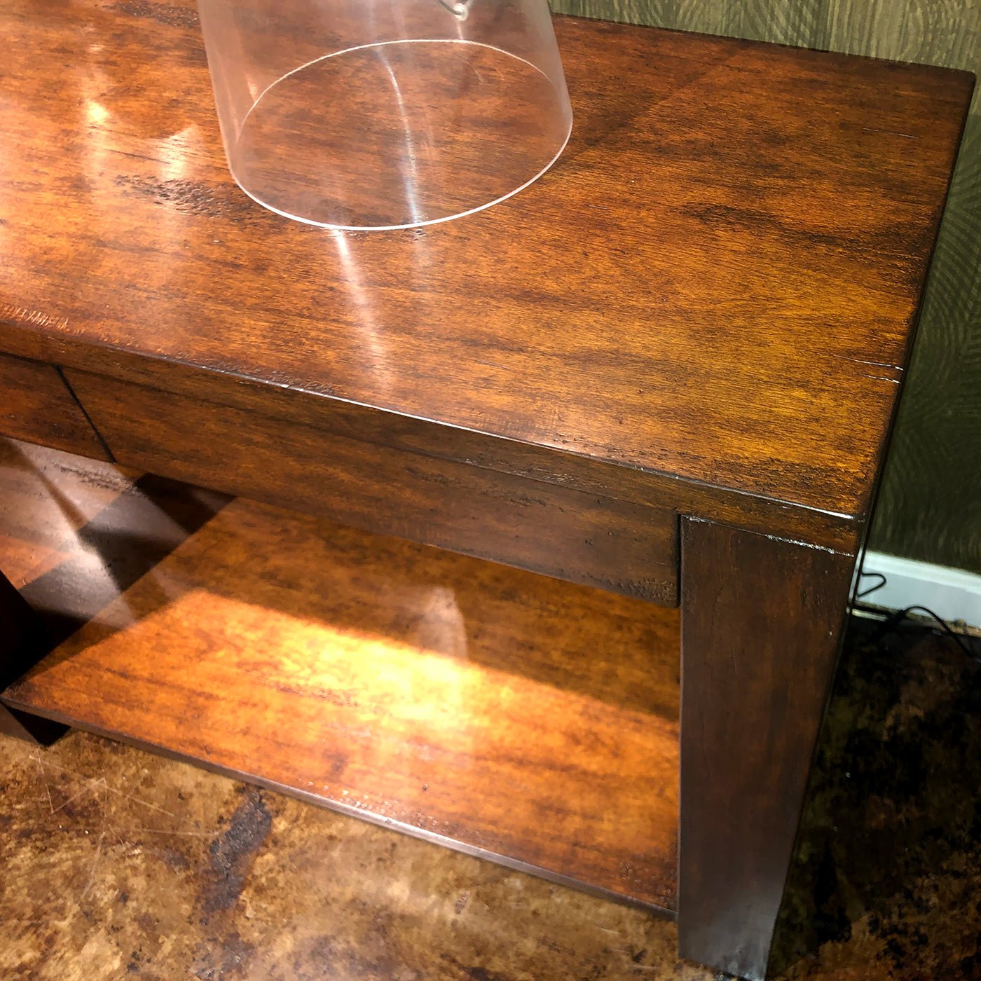 Detailed wood grain and surface of console table.