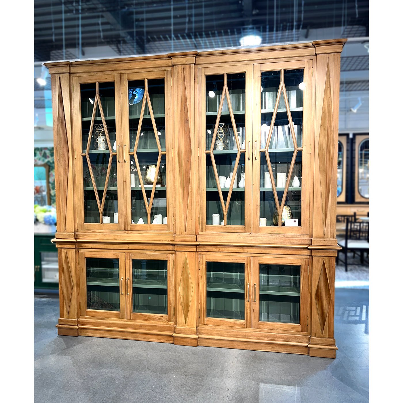 Wooden bookcase displayed in showroom, elegant neoclassic style.