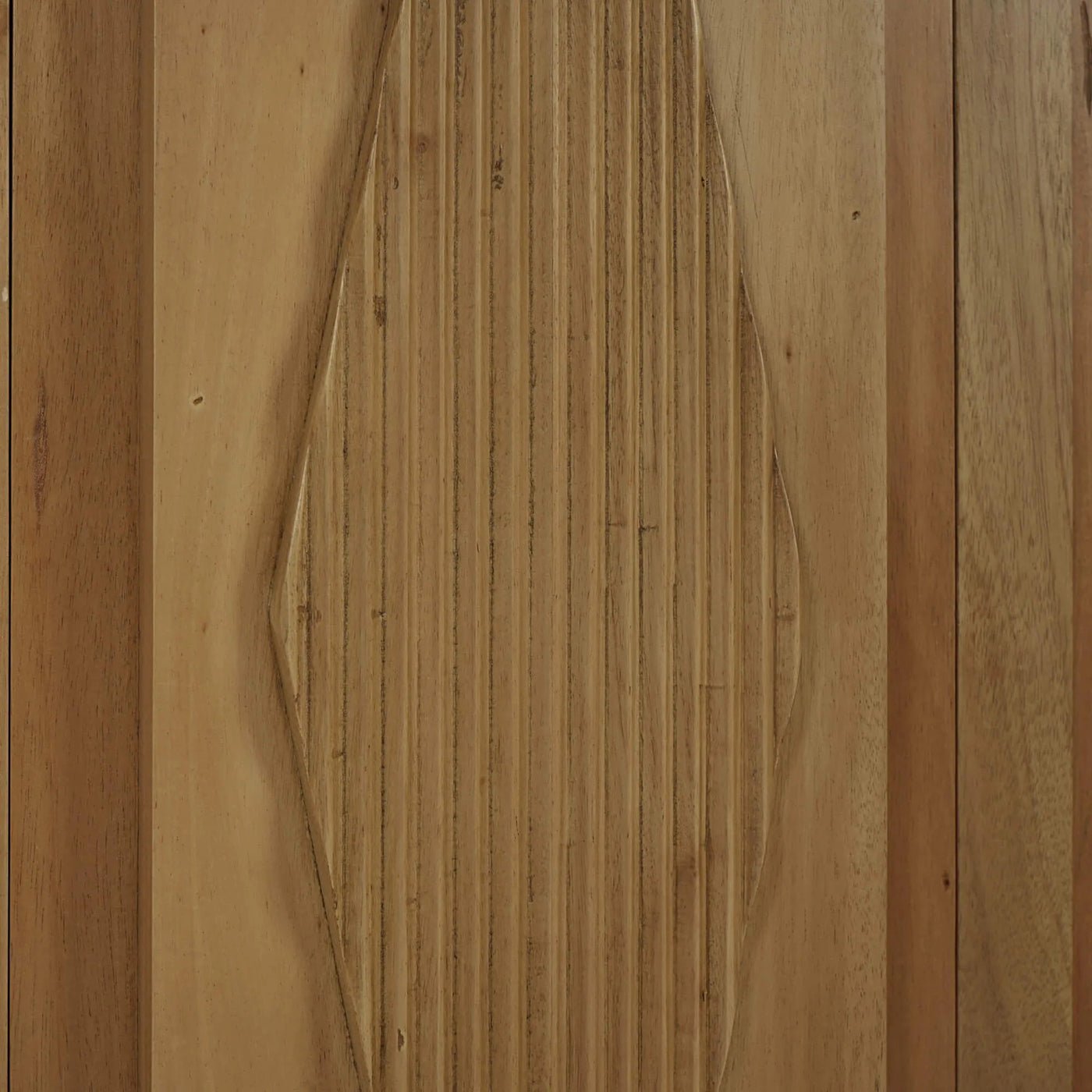 Detailed wood carving on bookcase panel, neoclassic design.