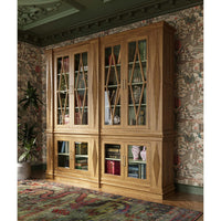 Styled bookcase with books and decor, vintage wallpaper.