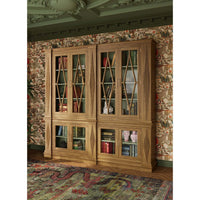 Bookcase in room with vintage wallpaper, styled interior.