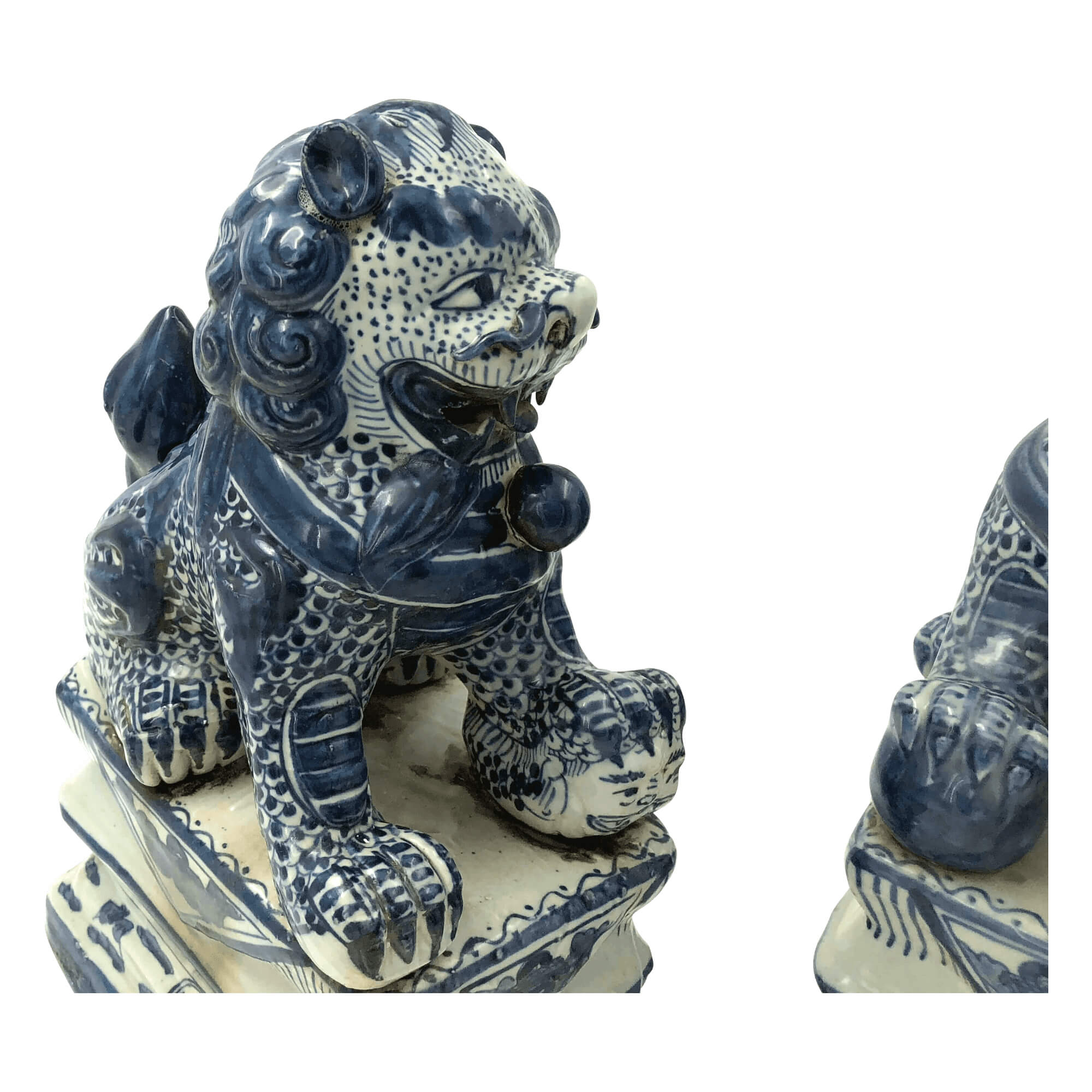 Close-up of one porcelain lion with intricate details.