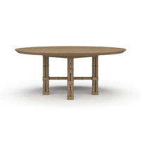 Round dining table, bamboo-style base, angled view.