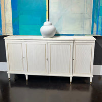 Regency credenza in gallery setting with decor item on top.