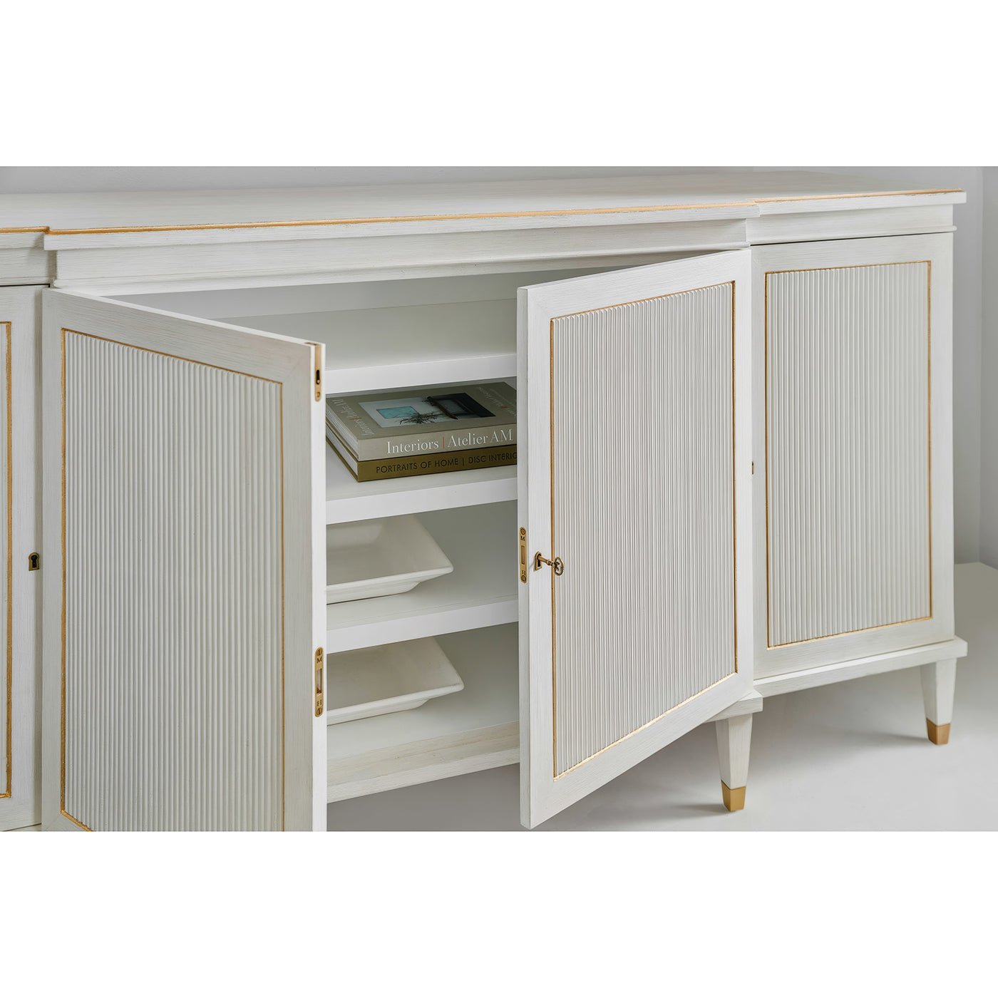 Open Regency credenza showing interior shelves with books.