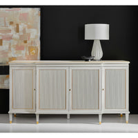 White credenza in styled room, lamp and art above.