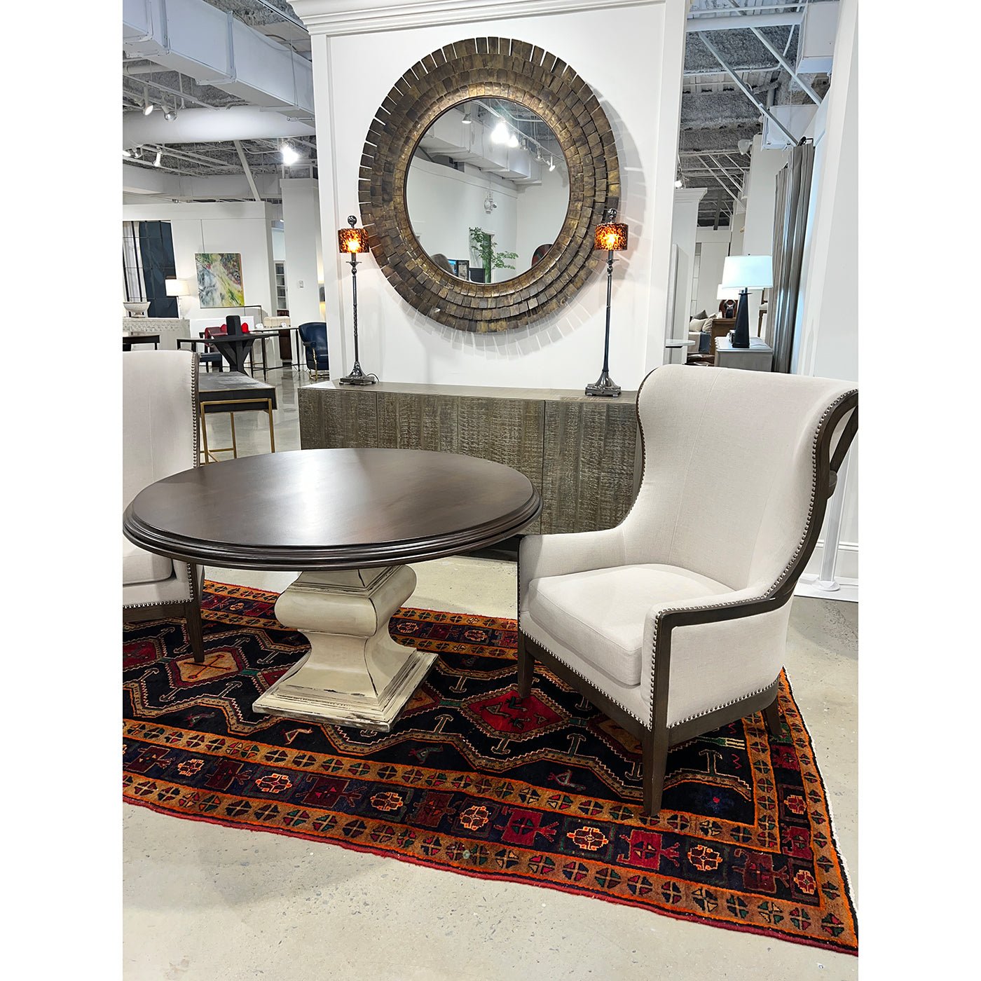 Art Deco mirror in decor setup with table and chair.
