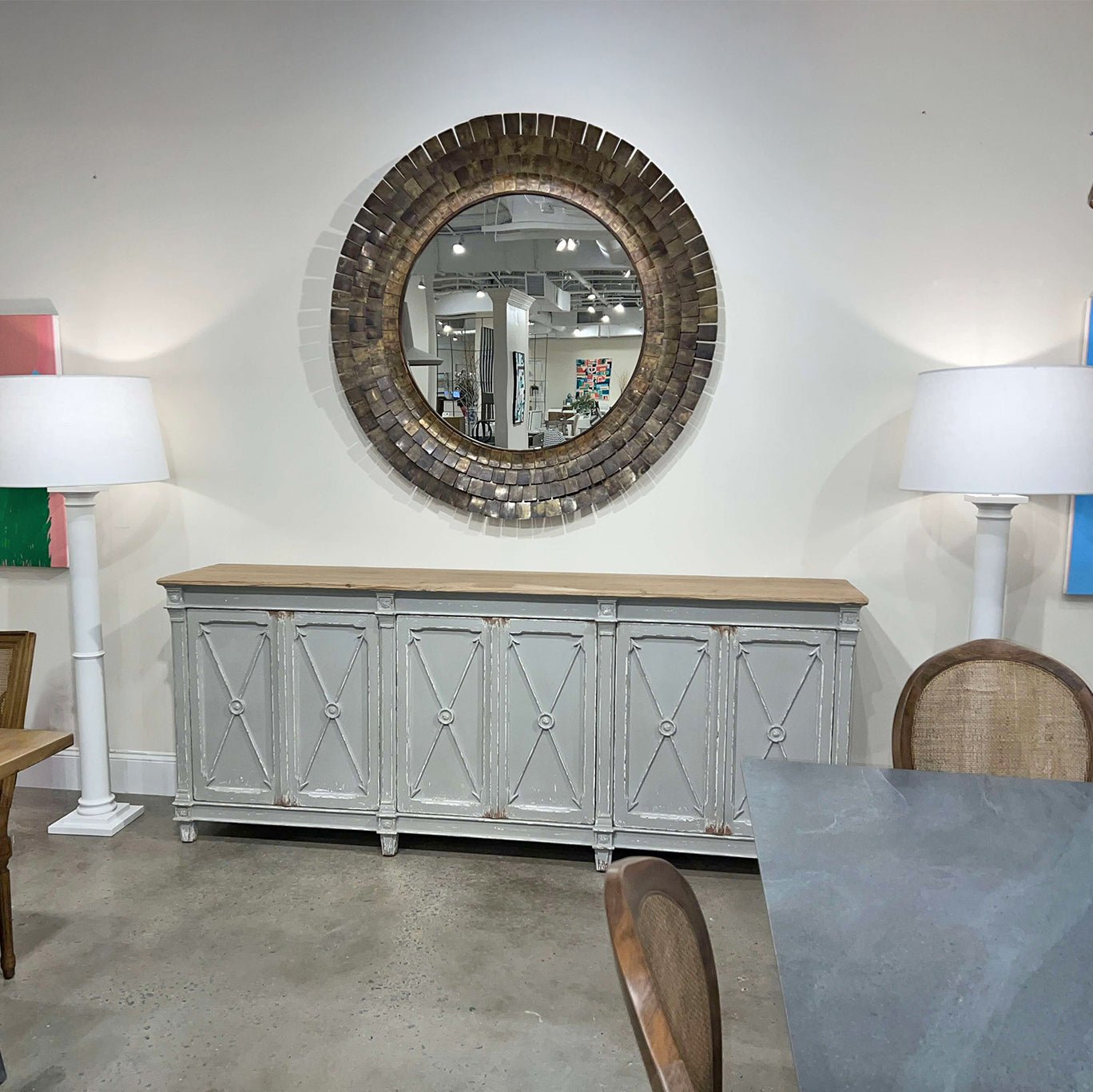 Art Deco mirror on wall, displayed with console table.