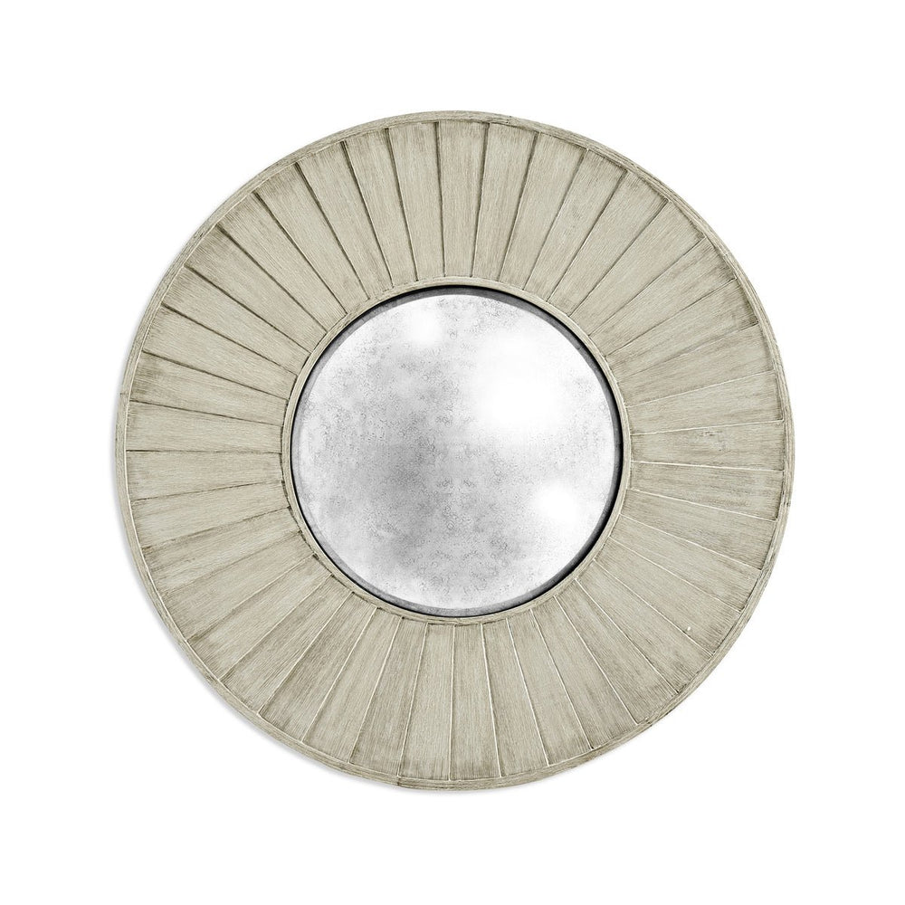 Round mirror with textured frame, full view.