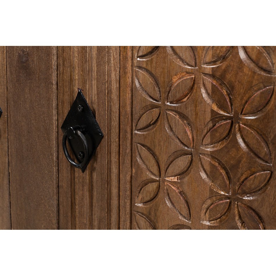 Close-up of carved design on rustic sideboard buffet.