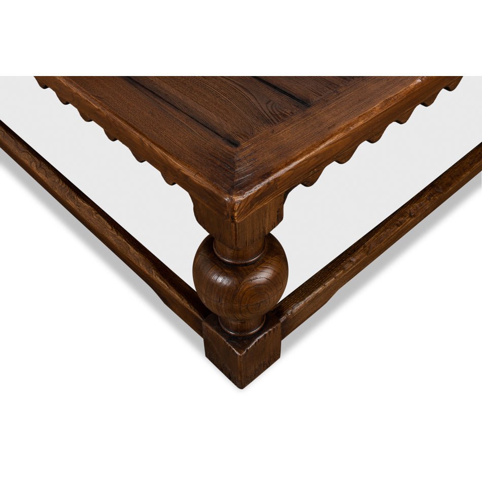 Edge detail of rustic square coffee table, focus on corner.