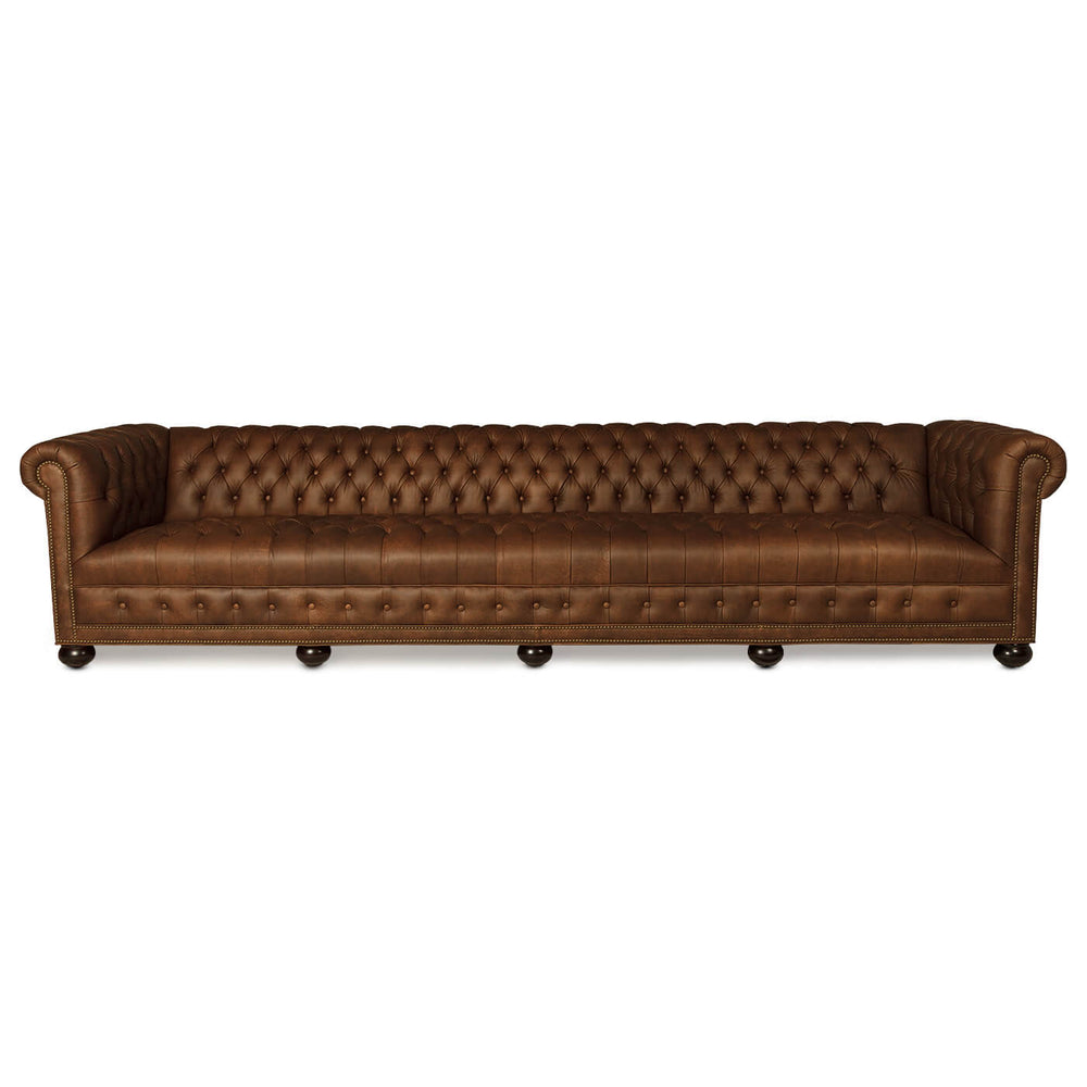 Brown leather Chesterfield sofa, full front view, four-seater.