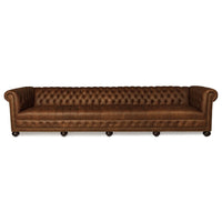 Brown leather Chesterfield sofa, full front view, four-seater.