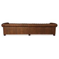 Rear view of four-seater Chesterfield sofa on wooden legs.