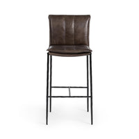 Front view of the slim-frame dark brown leather bar stool with a padded back, stitched seat and iron footrest