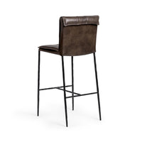 Three-quarter rear view of the slim-frame dark brown leather bar stool, showing the smooth back and rolled top edge