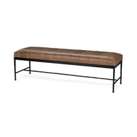 Angled view of a brown leather bench with a channeled seat, slender black iron legs and low stretcher