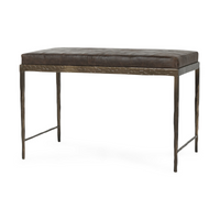 Angled view of the Cocoa Brown leather bench with a patchwork seat and slender hammered iron frame