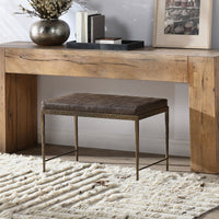 Cocoa Brown leather bench with a hammered iron frame beneath a wood console table