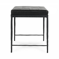 End view of the Onyx Black leather bench showing its patchwork seat and slim iron legs with crossbars