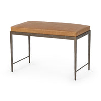 Angled view of the Sedona Brown leather bench with a square-stitched cushion and hammered iron base
