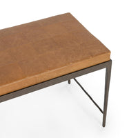 Close-up of the Sedona Brown bench showing square leather seams, a textured iron apron and a tapered leg