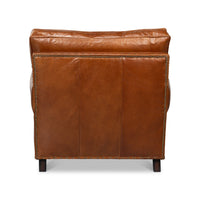 Brown leather club chair, back view.