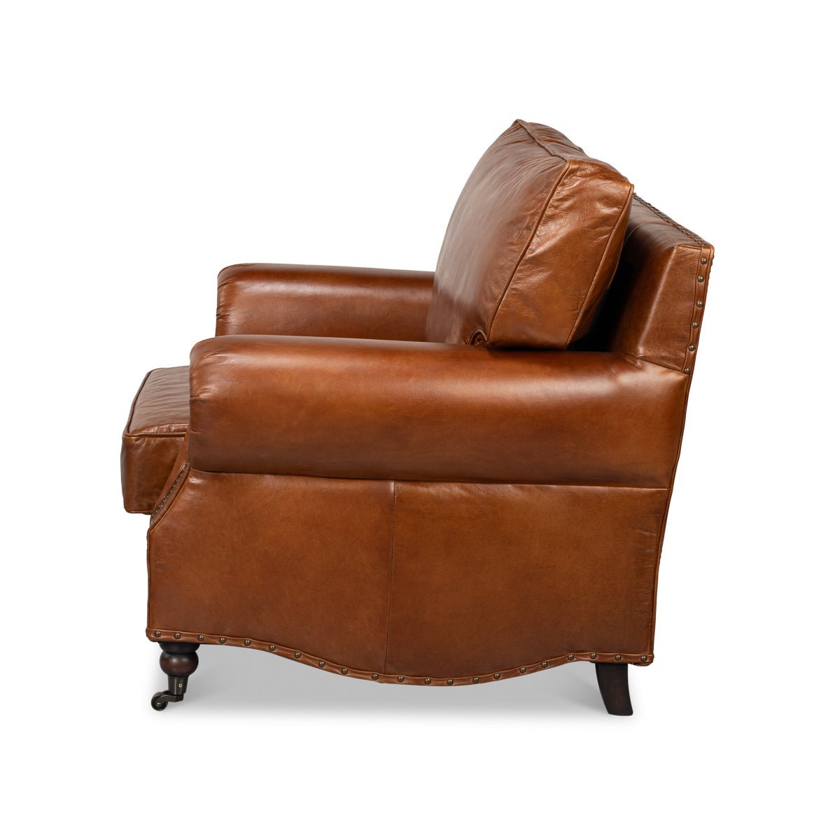 Brown leather club chair, side profile.