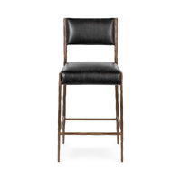 Front view of the black leather counter stool with a rectangular padded back and bronze-toned footrest
