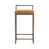 Front view of tan low-back leather counter stool with an open rectangular back rail and footrail.