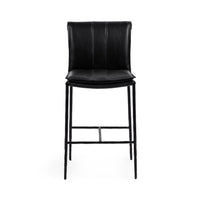 Front view of the slim-frame black leather counter stool with a padded back, stitched seat and iron footrest