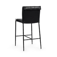 Three-quarter rear view of the slim-frame black leather counter stool, showing the smooth back and rolled top edge