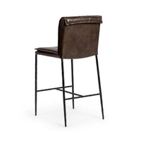 Three-quarter rear view of the slim-frame dark brown leather counter stool, showing the smooth back and rolled top edge