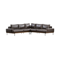 Wide front view of brown leather corner sectional showing its low frame and full cushion arrangement