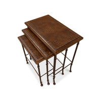 Overhead view of stacked brown nesting tables.