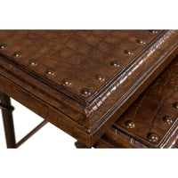 Detailed view of brown leather texture and metal studs.