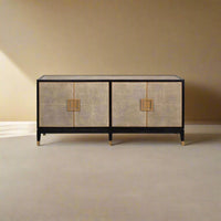 Leather wrapped midcentury credenza in room setting.
