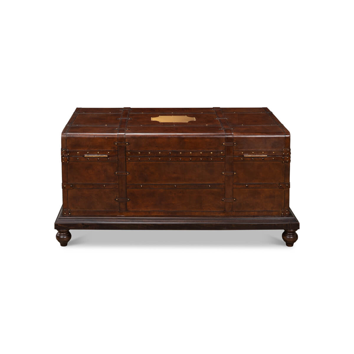 Side view, brown leather trunk coffee table with handles.