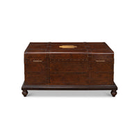 Side view, brown leather trunk coffee table with handles.