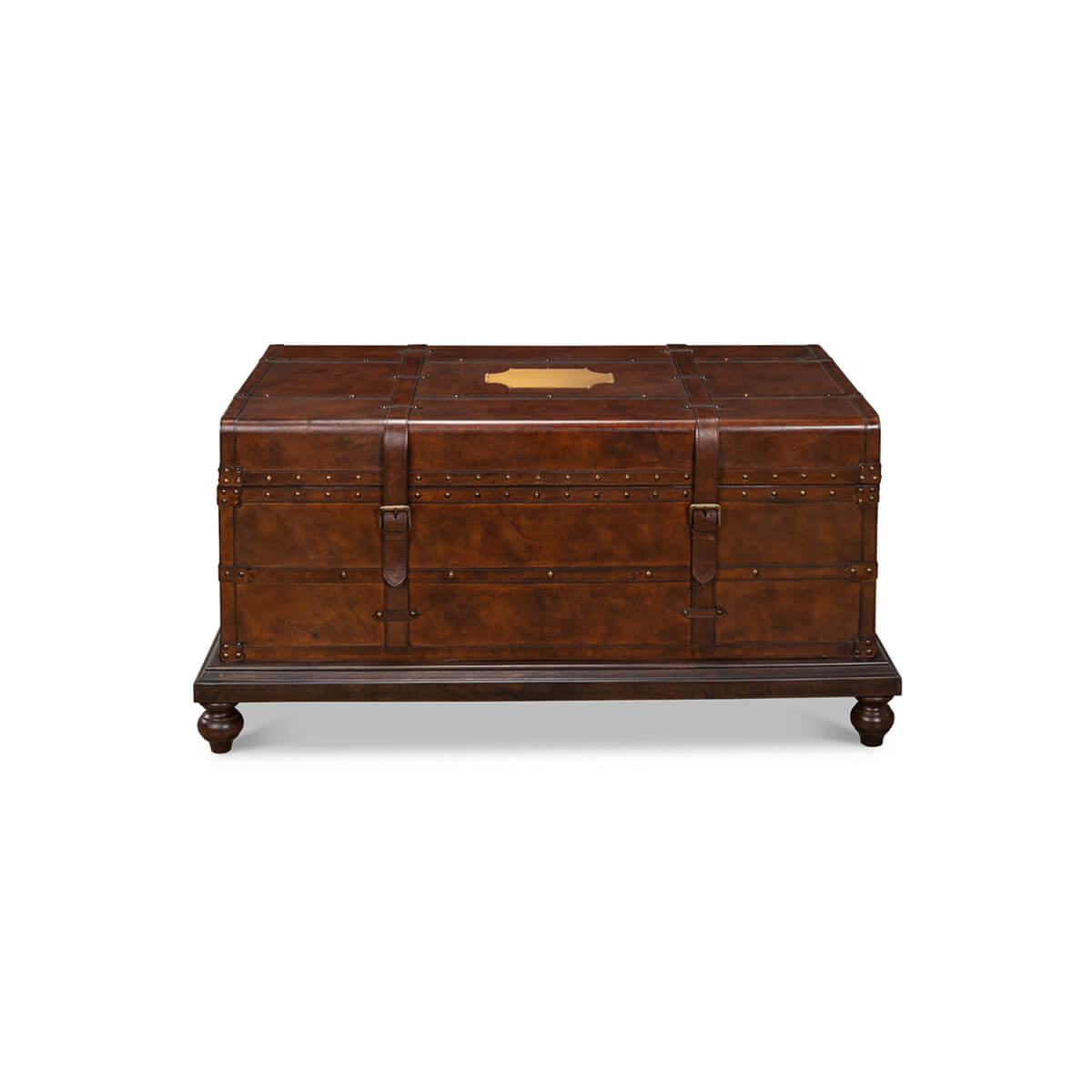 Front view, brown leather trunk coffee table with rivet details.