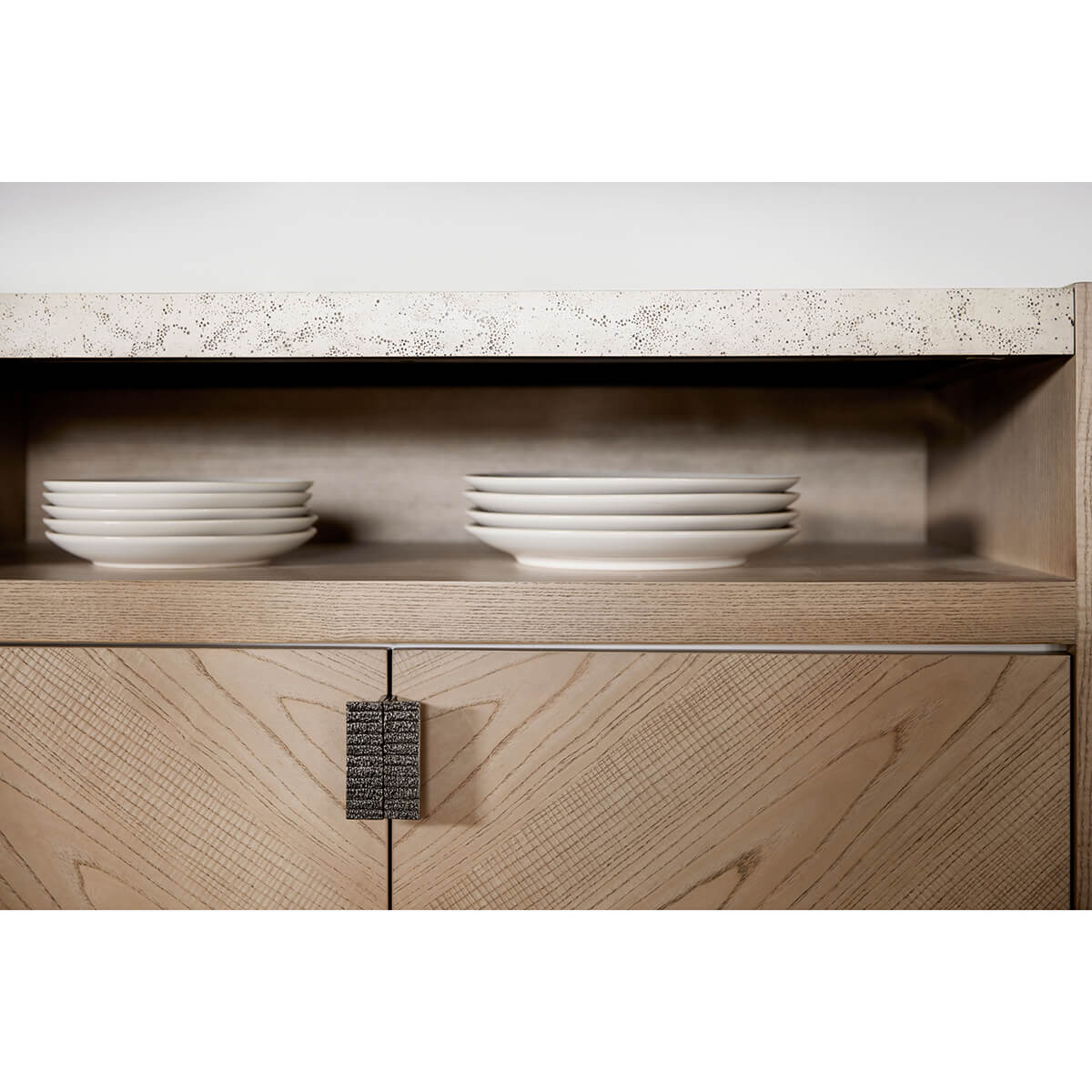 Light ash modern sideboard shelf with stacked plates.