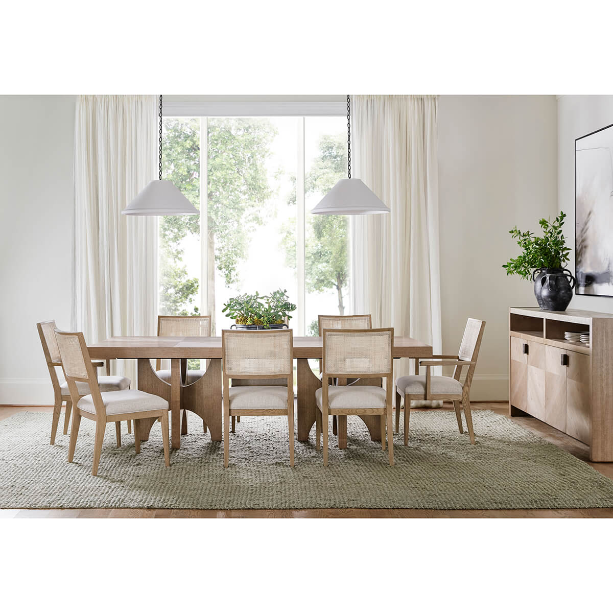 Dining room with light ash modern sideboard and table.